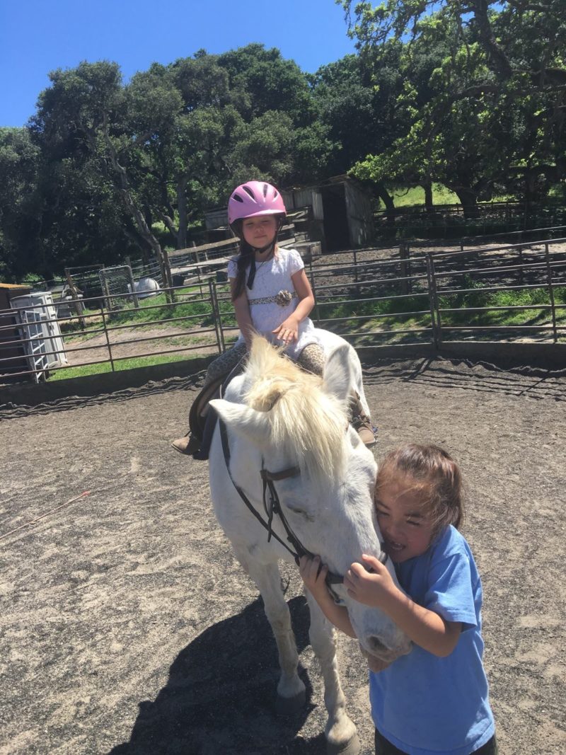 Paige (seated) and Payton Leach with Igloo at the Riding Academy of Salinas, CA.